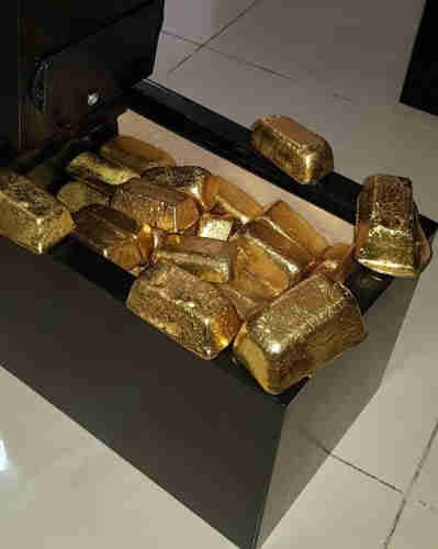 Gold bars , nuggets and dust